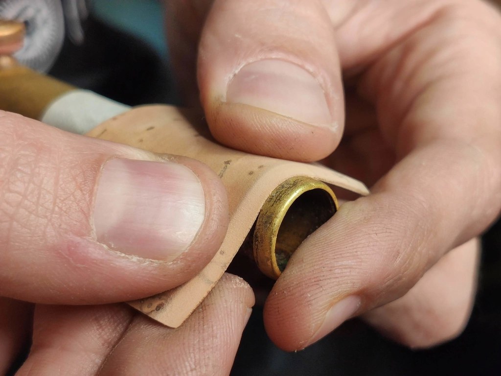 Cork being fitted to a saxophone neck